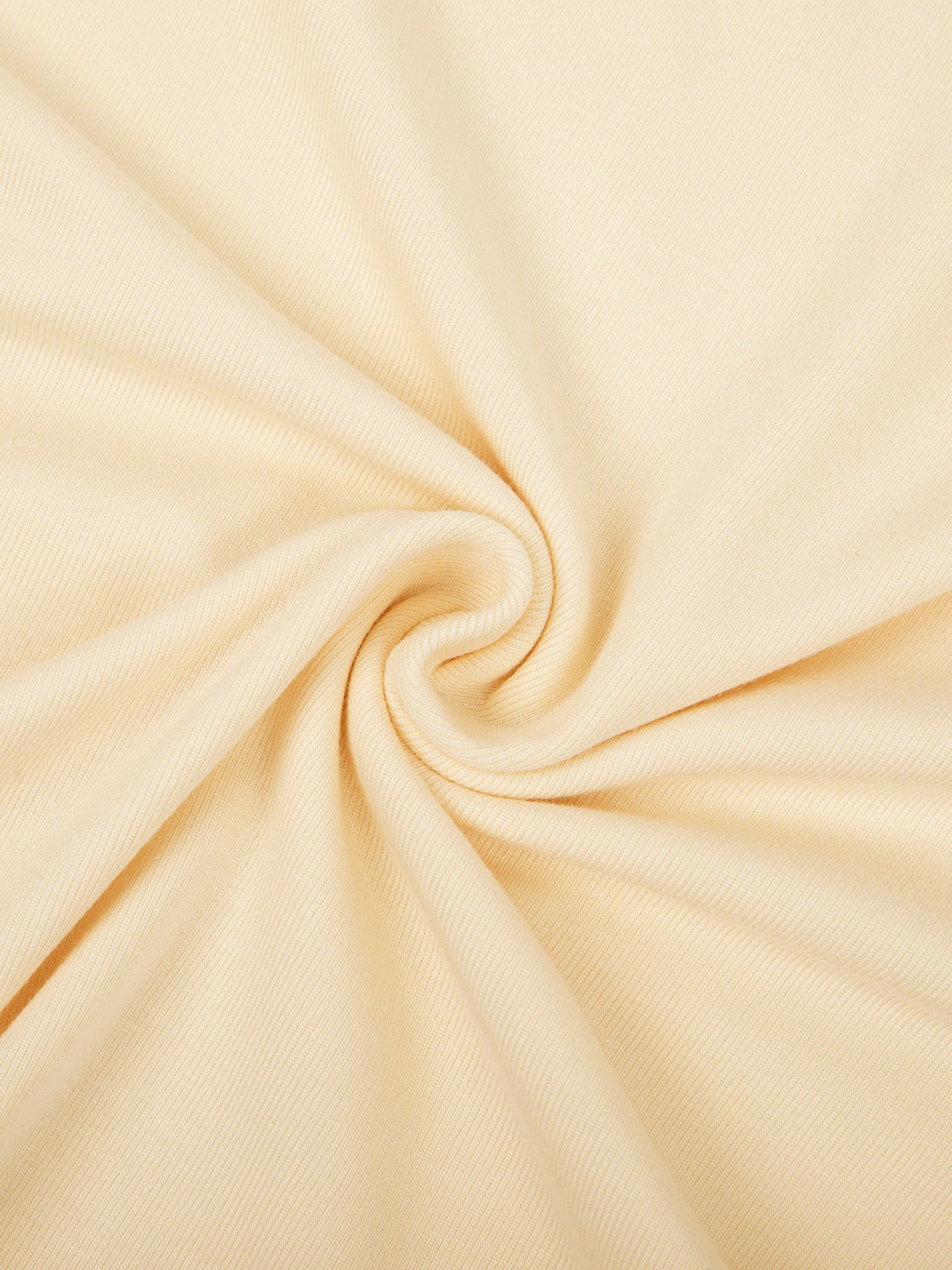 Close-up of beige fabric with a swirl pattern