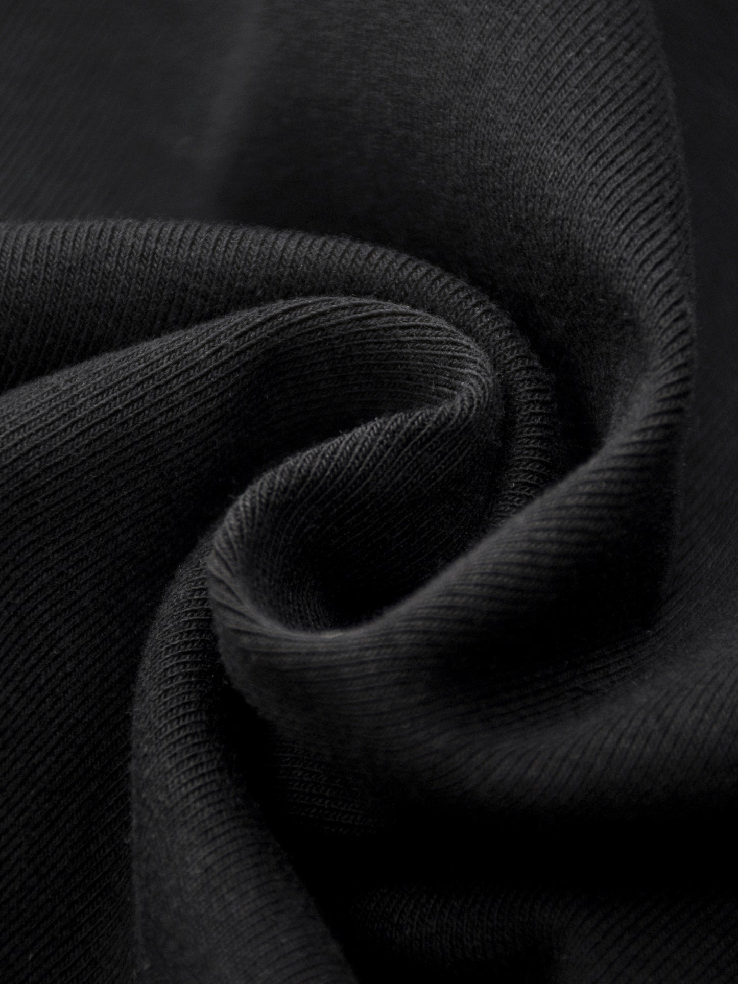 Close-up of dark gray fabric with a textured pattern