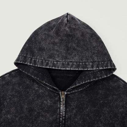 Close-up of black snow-wash hood and zipper area showing washed vintage texture.