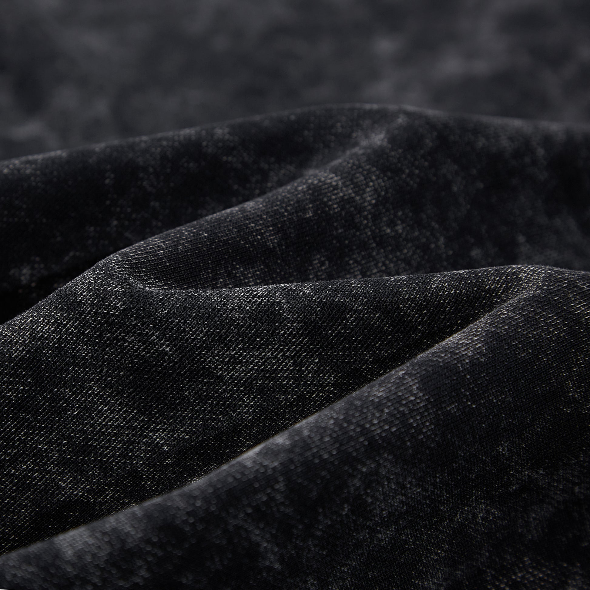 Close-up of black cotton fleece interior texture on SXDGXDS hoodie.