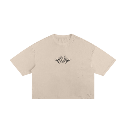 A beige T-Shirt with a black metal logo in the middle spelling "SXDGXDS"