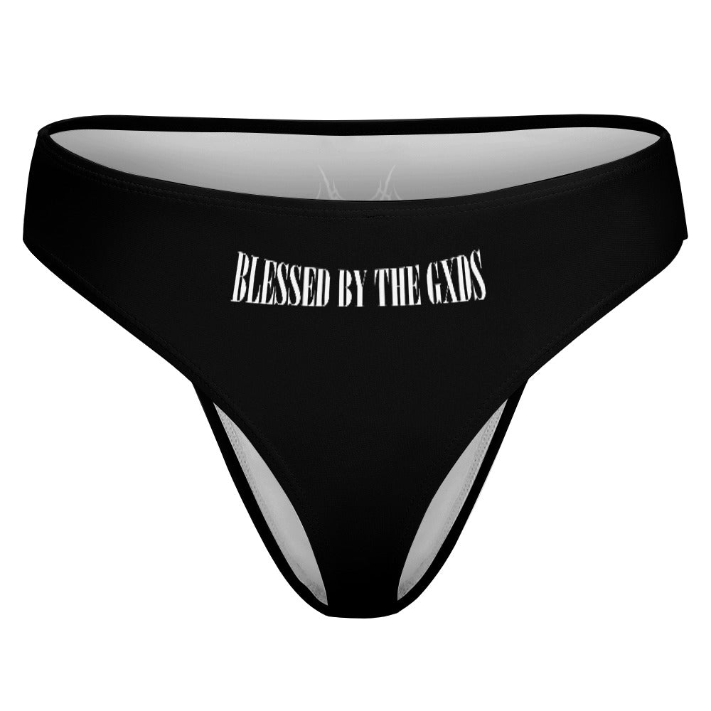 Back side of a women's thong by the brand SXDGXDS, saying "Blessed by the Gxds" in the middle