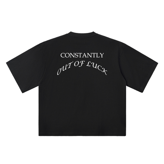 Black t-shirt with white text 'CONSTANTLY OUT OF LUCK' on a white background