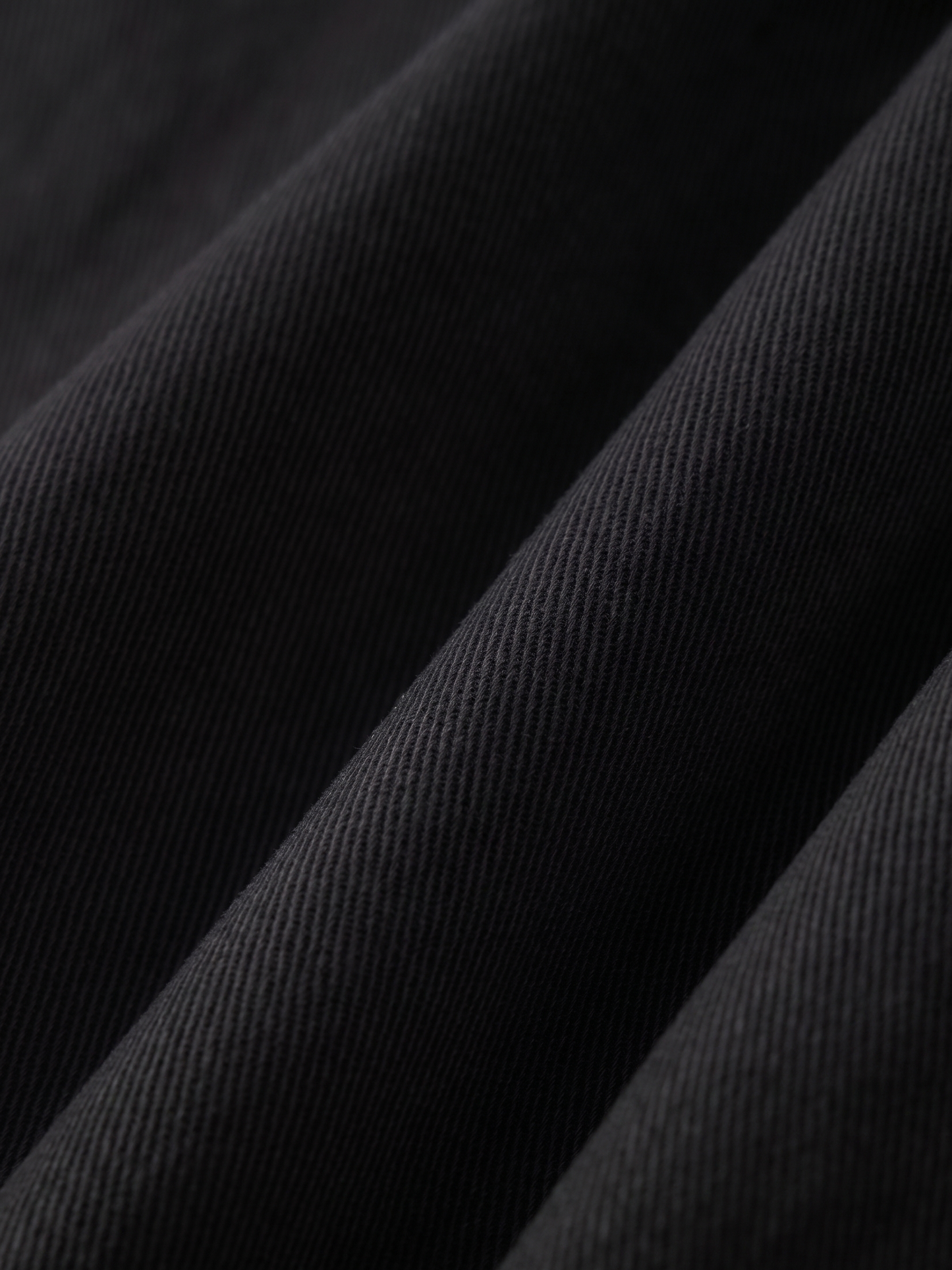 Close-up of black fabric with a subtle texture