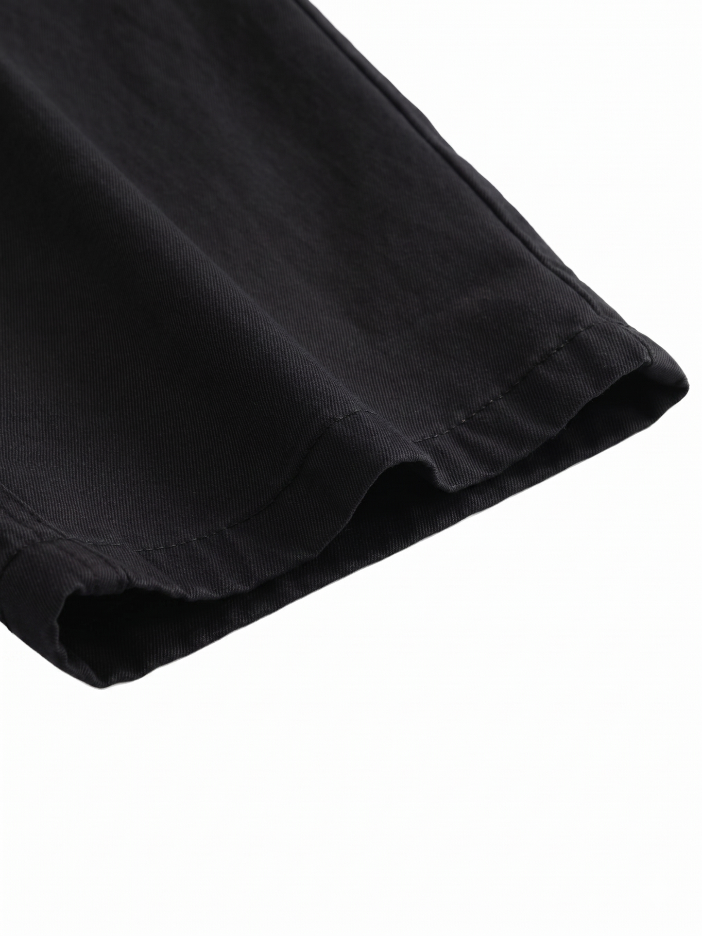 Close-up of a black fabric texture on a white background