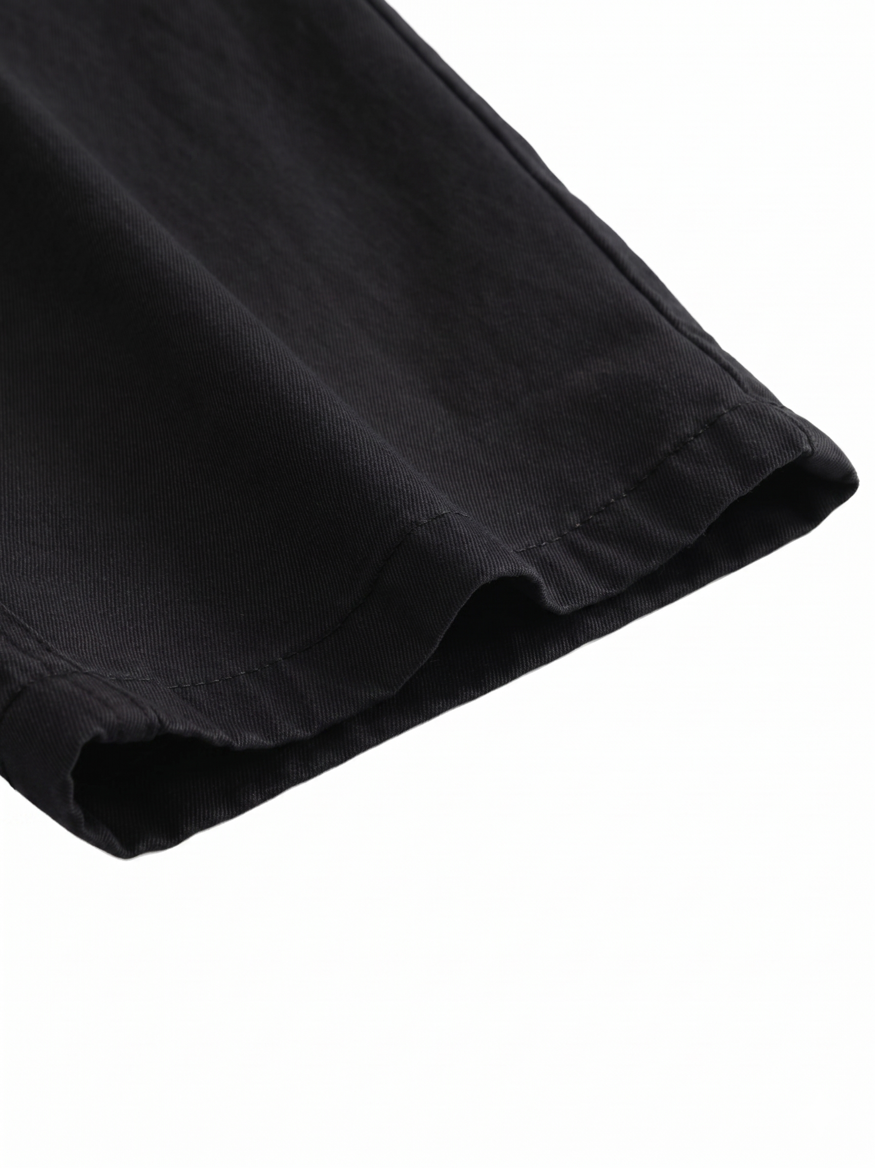Close-up of a black fabric texture on a white background