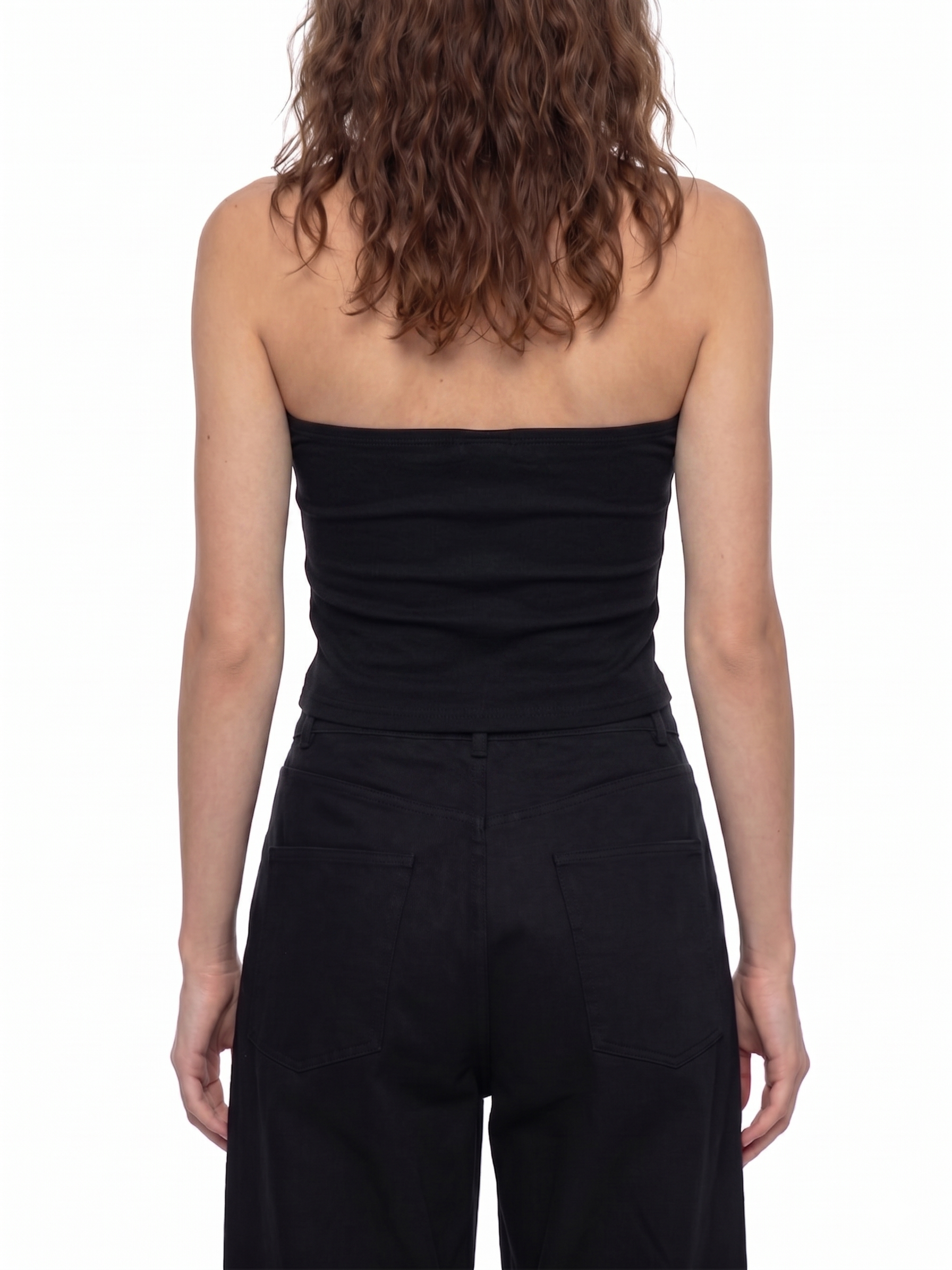 Black strapless top and high-waisted pants on a white background