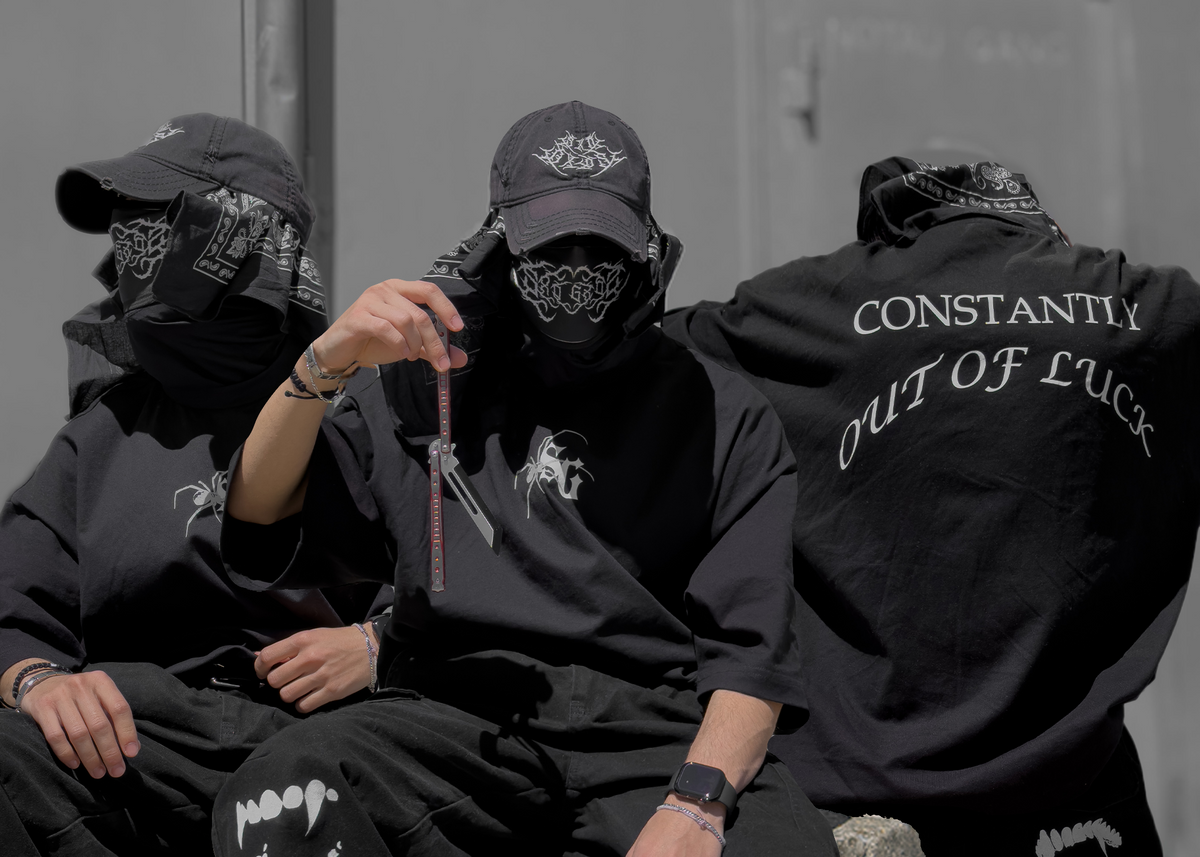 SXDGXDS streetwear crew in black oversized tees and caps
