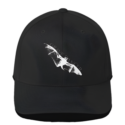 A black baseball cap with a curved visor features a white graphic of a bat wing and the text "GRAVE DANCER" on the front.