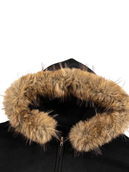 Close-up of tan faux-fur hood lining on black SXDGXDS zip hoodie.