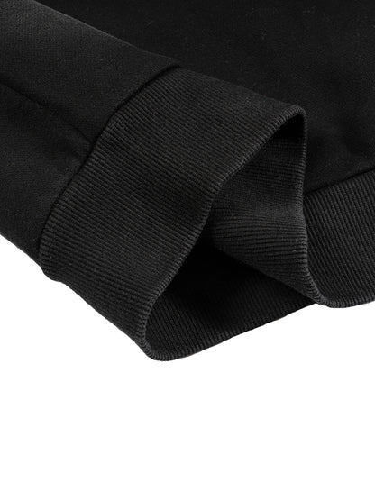 Detail shot of black hoodie sleeve and ribbed cuff finish.