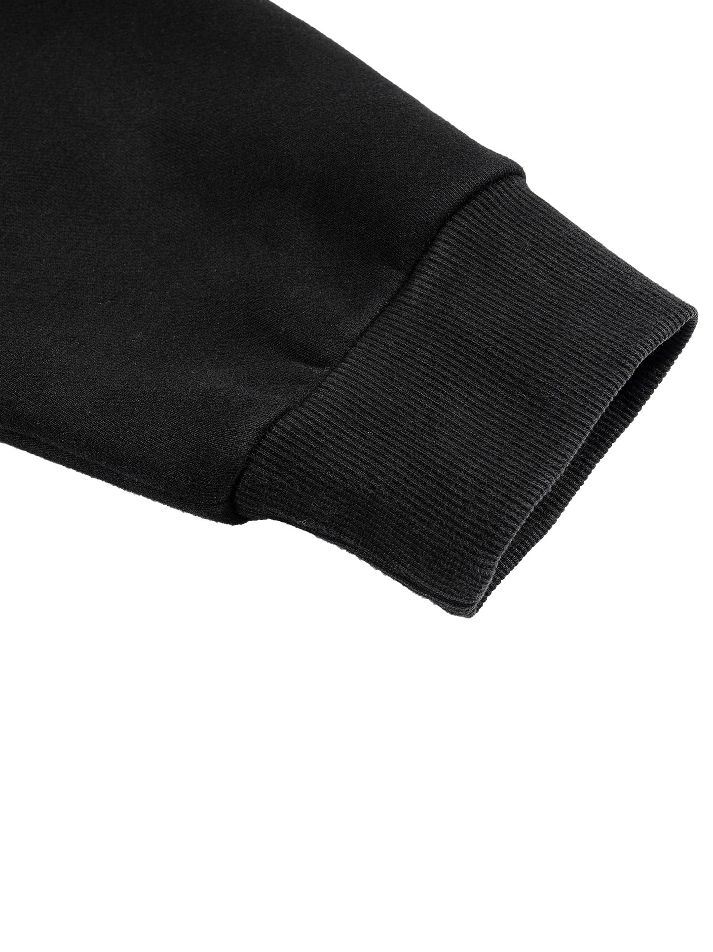 Detail shot of black hoodie cuff showing thick cotton-blend fabric.