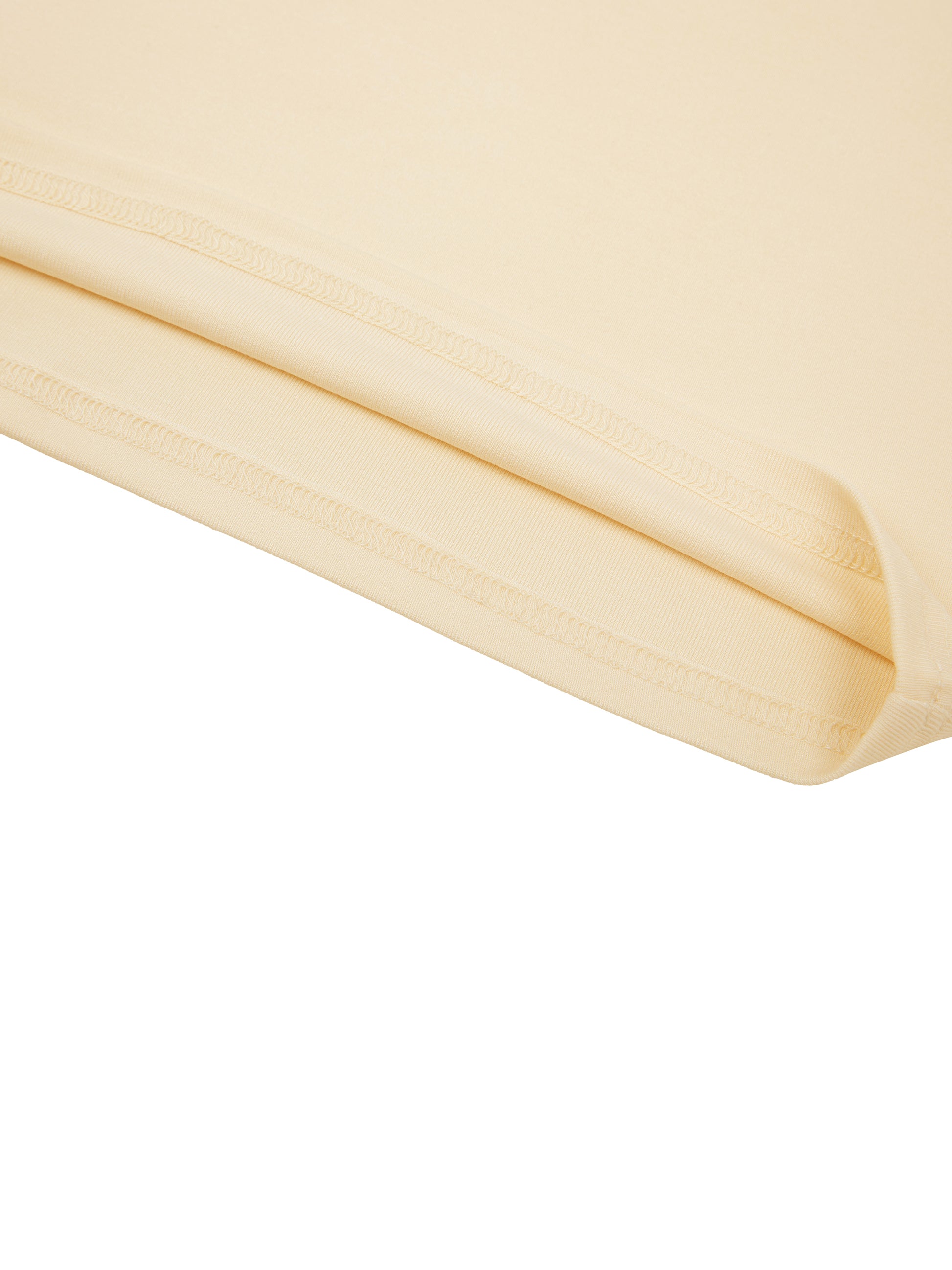 Close-up of beige fabric with a white background