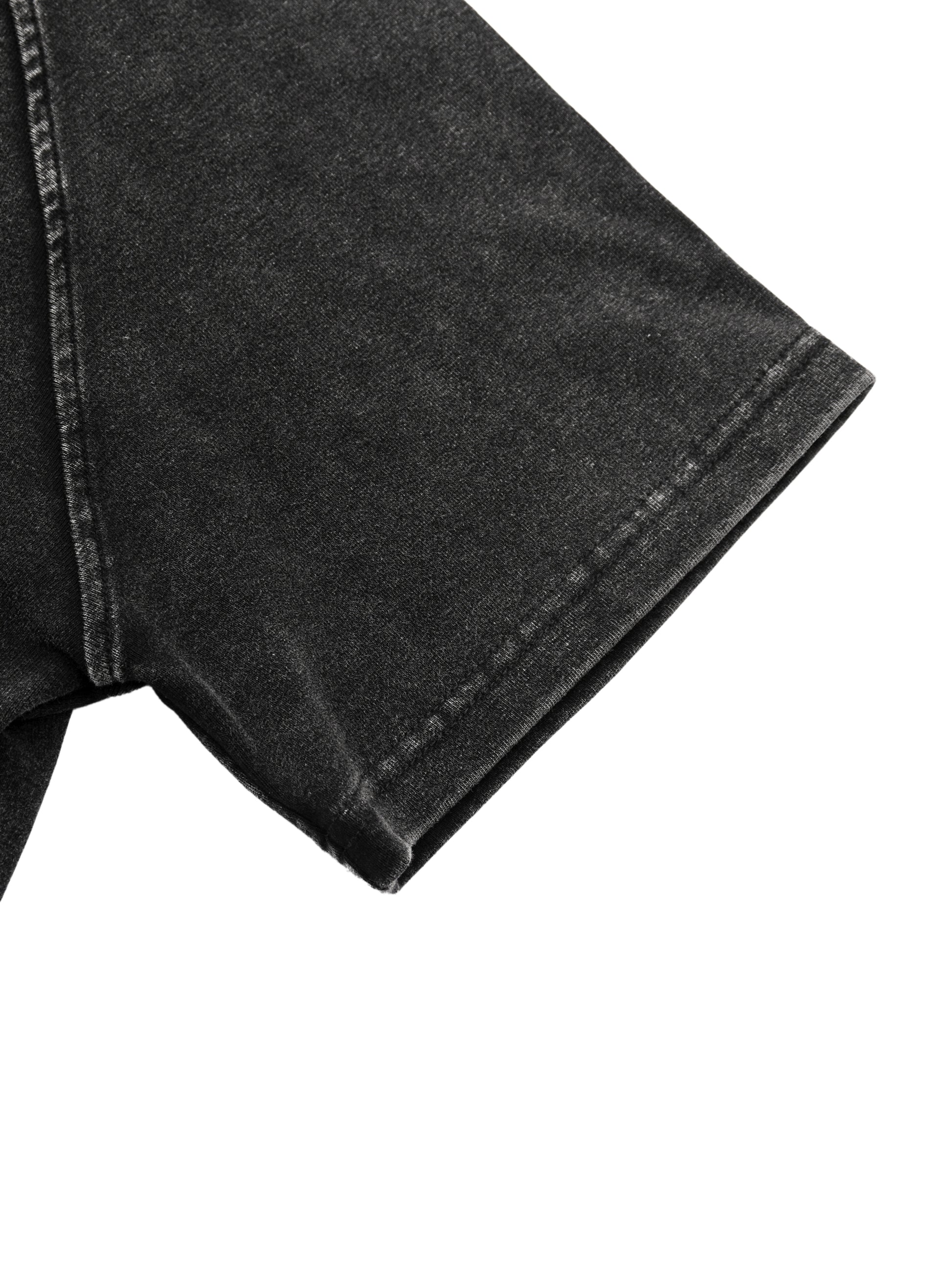 Close-up of black denim fabric on a white background