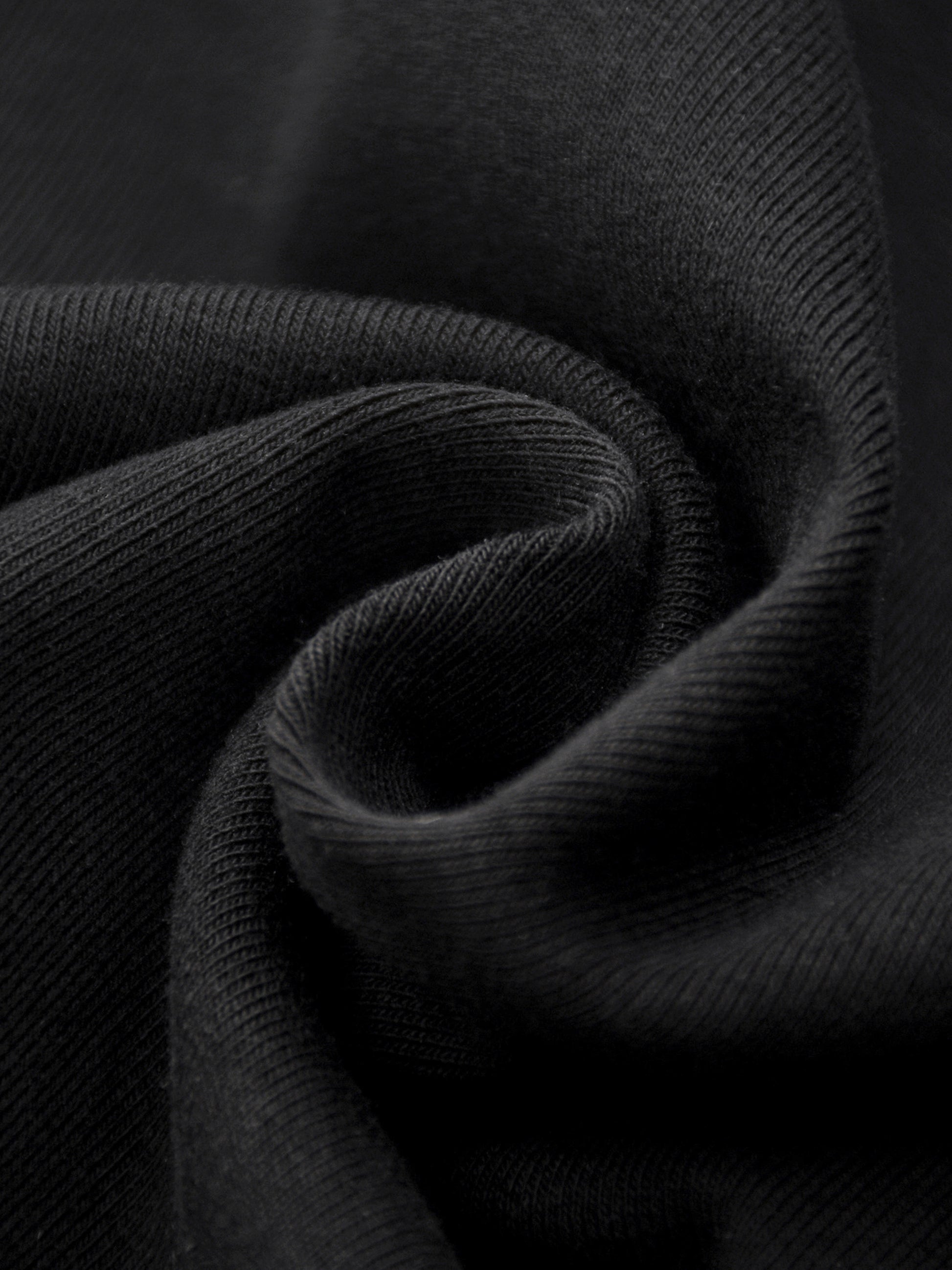 Close-up of dark gray fabric with a textured pattern