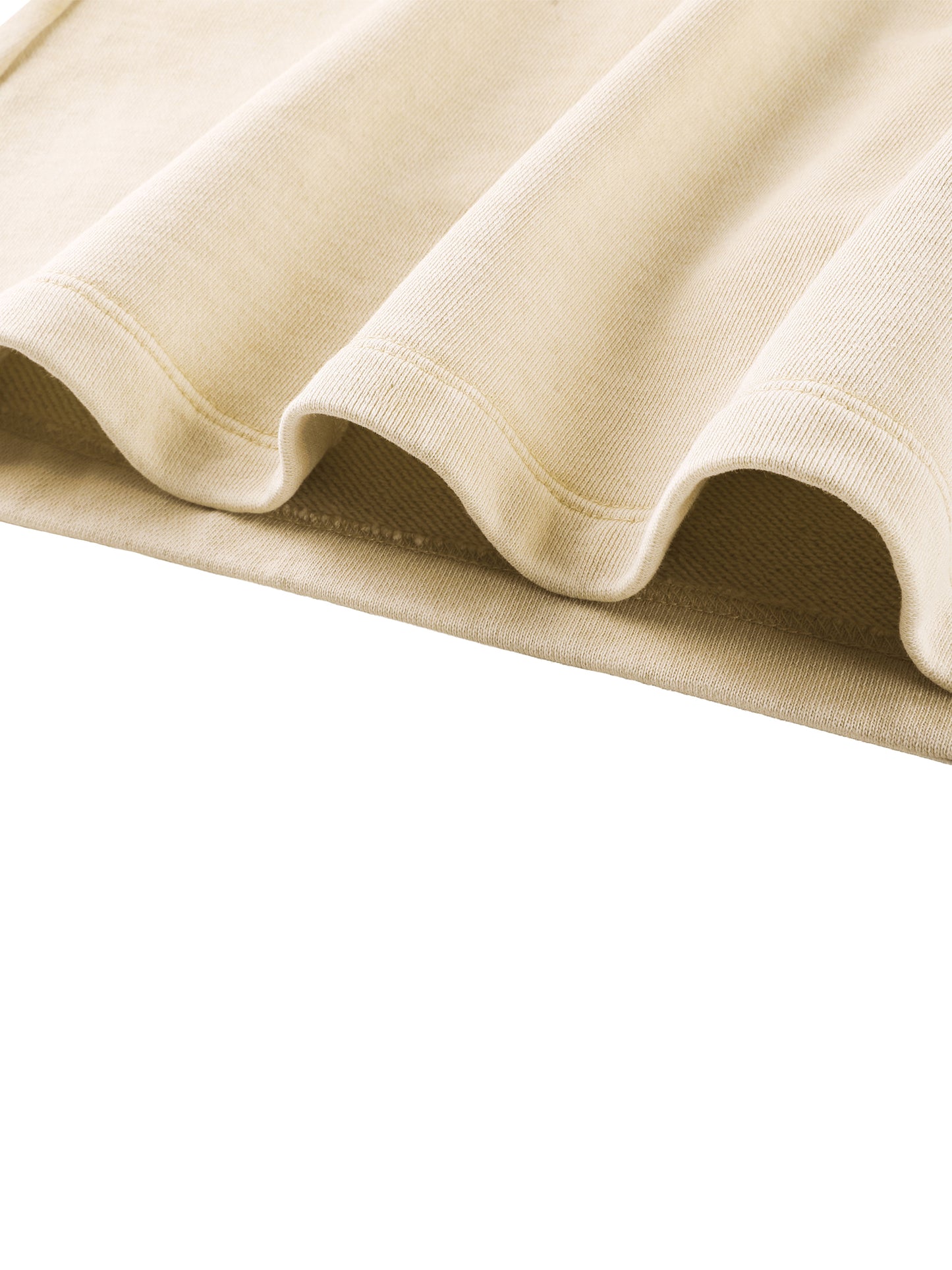 Close-up of beige fabric with a white background