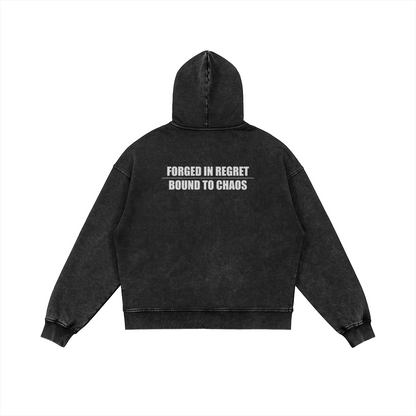 Back view of black snow-wash SXDGXDS zip hoodie with white “FORGED IN REGRET / BOUND TO CHAOS” text print.